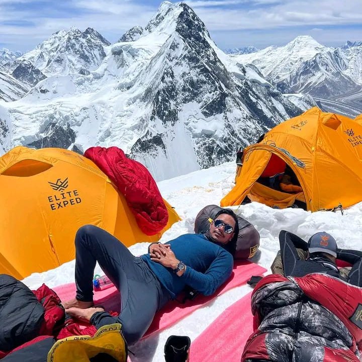 Resting at a high camp with expedition tents